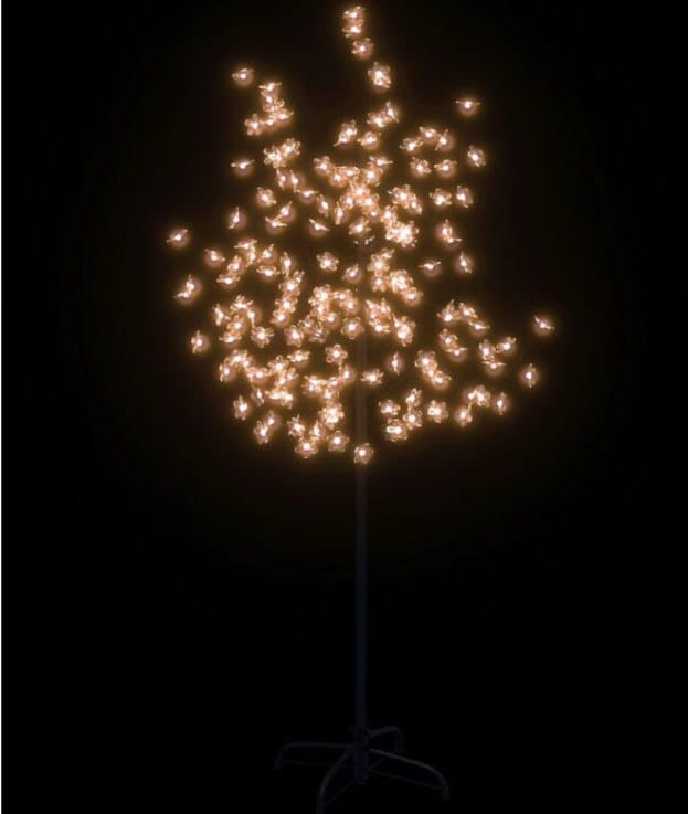 Albero acceso al buio: i fiori di ciliegio diffondono una luce bianca calda su tutta la chioma