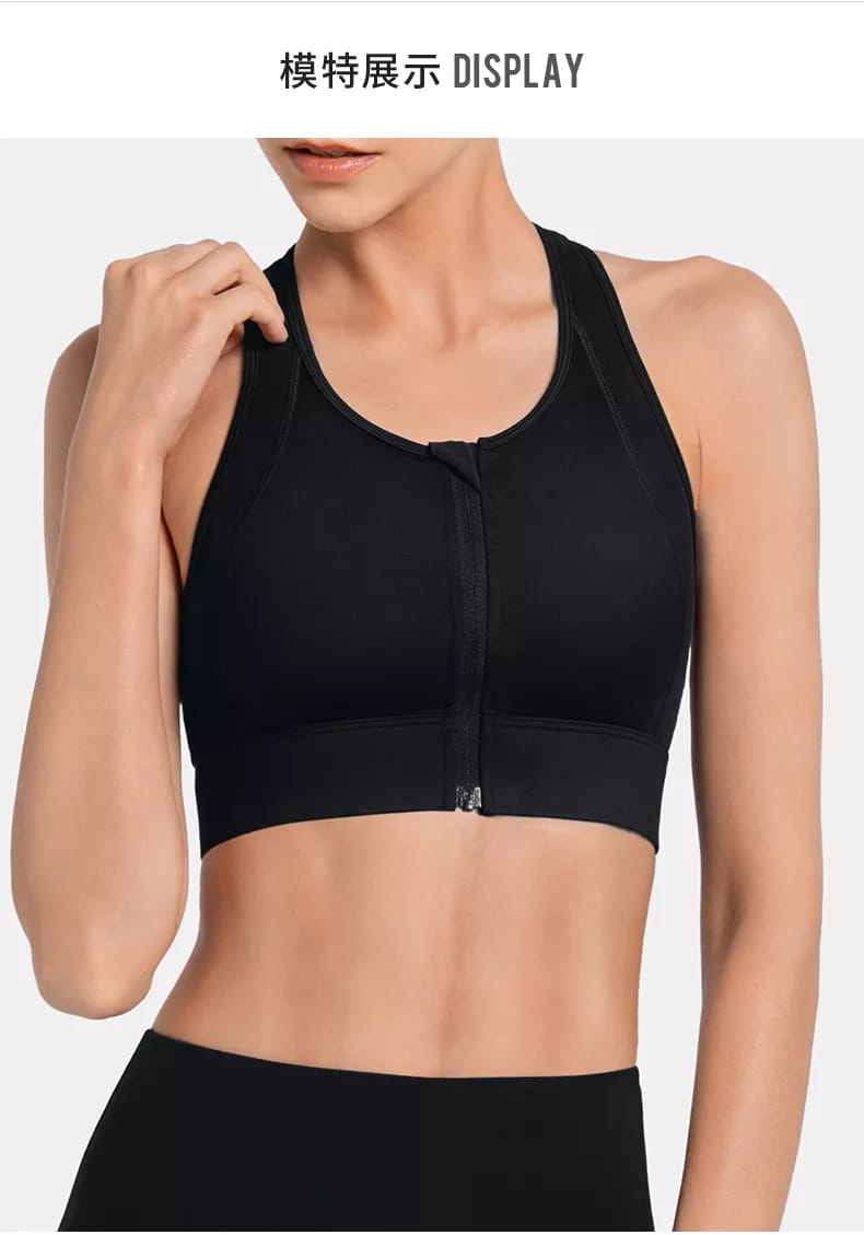 Dettaglio ravvicinato della zip frontale e delle spalline incrociate del reggiseno sportivo nero