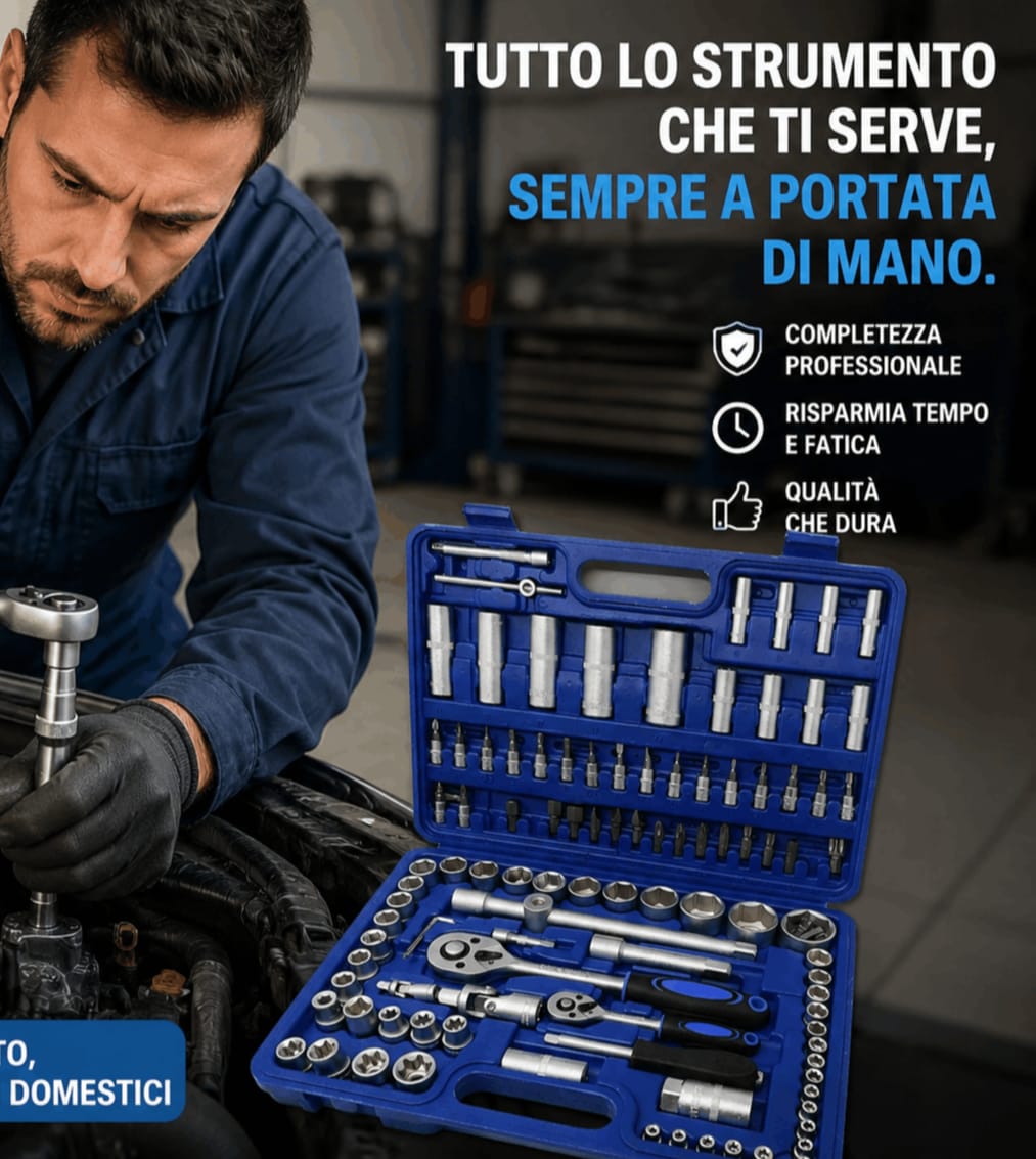 Meccanico in tuta blu al lavoro su un motore accanto alla valigetta aperta piena di bussole cromate